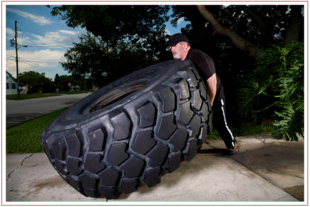 Tom Lifting a 1046 lb. tire!