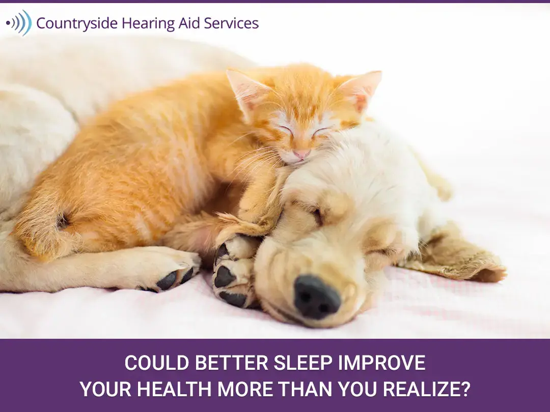 Could Better Sleep Improve Your Health More Than You Realize? Orange kitten sleeping on a light-colored dog with headline about better sleep and health by Countryside Hearing Aid Services