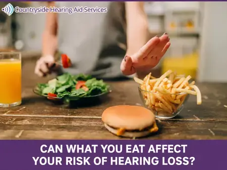 Person turns away from fries and a burger toward a salad in a Clearwater graphic about diet and hearing loss